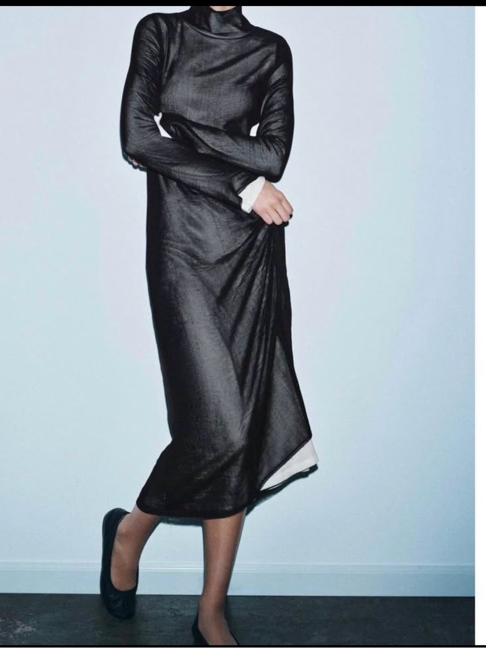 Nice stylish, long dress, a sheer black on top of with cotton dress very strachy
